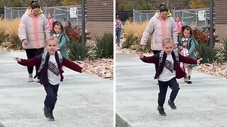 Silly kid tries to act cool in front of mom