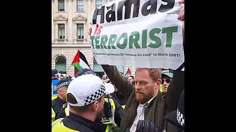 Metro Police Officers Threaten To Arrest Jewish Man Holding A 'Hamas Is Terrorist' Sign In London