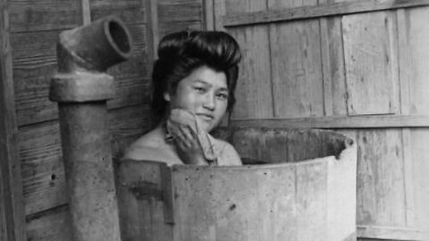 Japanese people 100 years ago Pictures of Japan Baths shrines and temples Children babysitting