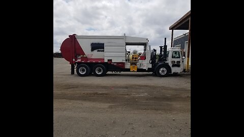 #1277-1 McNeilus Manual Side Loader with Cart Tipper.