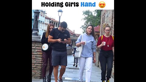holding girls hand