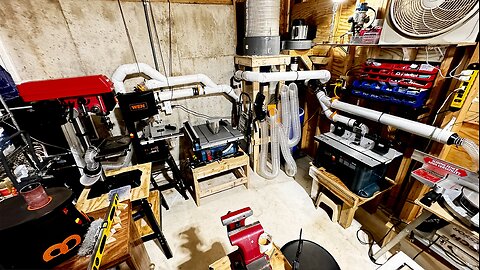 Retired middle-aged man puttering around in basement building out a wood workshop
