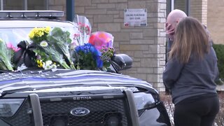 Community pays respect after officer is shot and killed