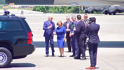 Biden looks lost and confused after touching down in Charlotte — holding onto the mayor's hand for dear life.