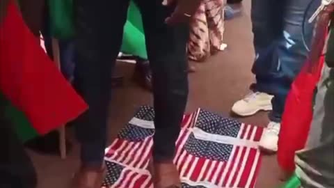 Burkina Faso's capital Ouagadougou, protesters trample on the stars-and-stripes flag at US Embassy