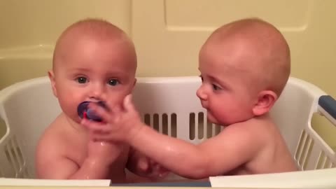 Twin Sharing a Pacifier - So Cute