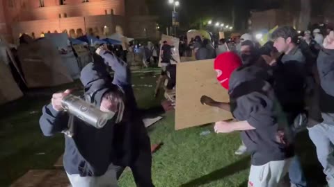 At UCLA, a violent brawl has broken out with both sides fiercely fighting.