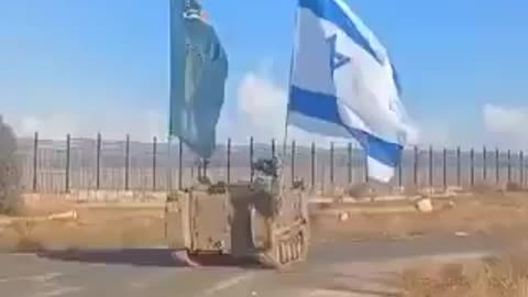 Israeli military vehicles drive along the Egypt-Gaza border with obnoxiously large
