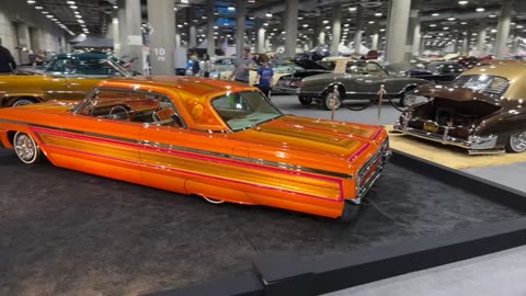 Orange 1964 Chevrolet Impala Lowrider in Chicano Style