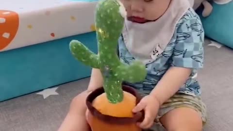 Babies play dancing cactus toy. Cutest baby funniest moments