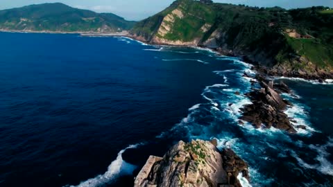 Drone shot of powerful sea water on epic coastline