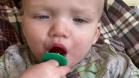 Twin tries a ring pop for the first time. Adorable