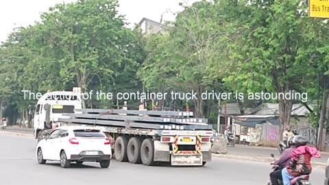 The action of the container truck driver is astounding, fast turning around in a narrow area