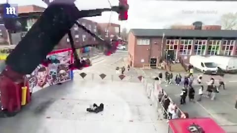 Terrifying moment fairground ride falls apart while in mid-air