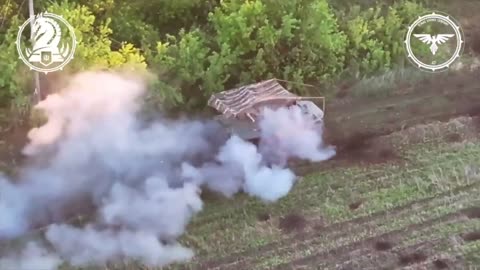 Ukrainian Bradley fires at a Russian MT-LB