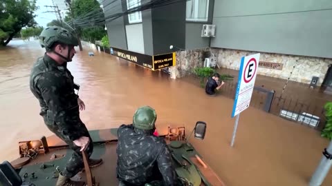 Army rescues man clinging to fence in flood-ravaged Brazil
