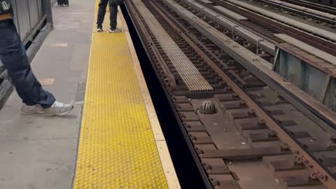 Man Walking Down Train Tracks