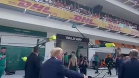 Trump Walks Out To A Huge Welcome At Formula One With USA Chants