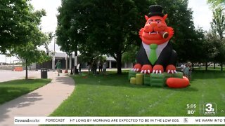 Nebraska group protests corporate greed, inflation with inflatable 'fat cat' Friday