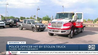 Tolleson PD officer pinned by suspect in stolen vehicle