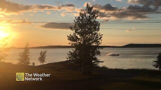 Jet skiing during a magnificent sunset over Birchy Bay