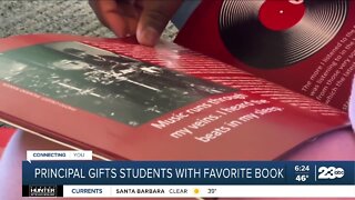 Principal gifts students with favorite book