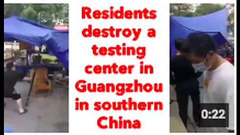 Residents destroy a testing center in Guangzhou in southern China
