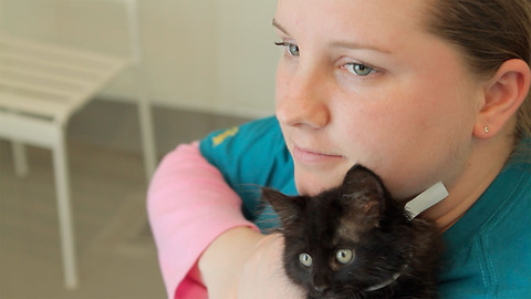 Young, autistic woman finds the confidence to speak through love of black cats