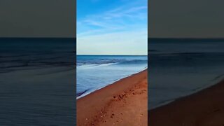 Calm water on a red beach