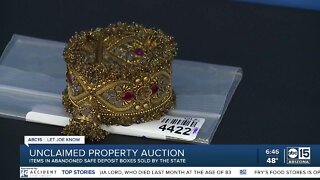 State auctioning unclaimed property including coins, silver, and sports cards