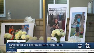 Family & friends hold candlelight vigil for boy shot and killed on Thanksgiving