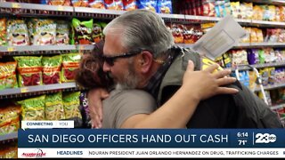 San Diego officers hand out cash