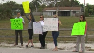 Protest for and against teacher who put up Satanic display