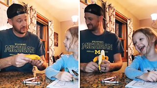 Little girl cracks up at dad's silly joke