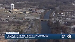 People in Flint react to charges