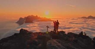 Stunning midnight sun on top of a mountain in Norway