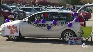 Centennial High School seniors pick up caps and gowns