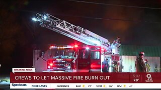 Crews to let massive fire burn out