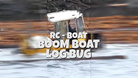 LOG BOOM BOAT SORTING LOGS ON A RIVER IN CANADA