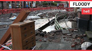 Residents flee their homes in the early hours after a burst water main floods 100 properties