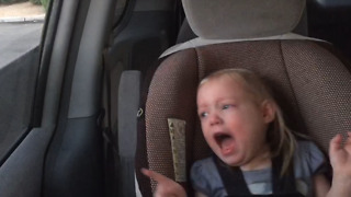 A Little Girl Is Scared Of A Car Window Rolling Down