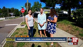 Parents and children guarding crosswalks