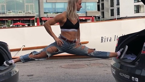 Woman performs epic split on two vehicles