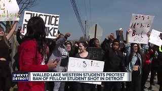 Students hold walkout protest after Walled Lake school banned teen who was shot