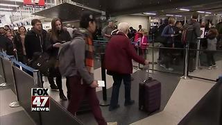 Travelers return home after holiday vacation