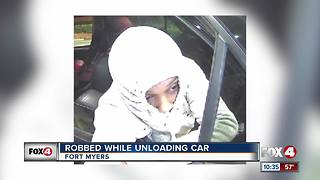 Woman Robbed While Unloading Her Car