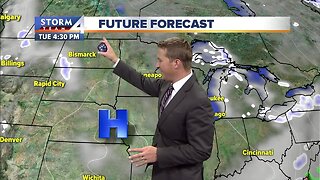 Cold with decreasing clouds Tuesday afternon
