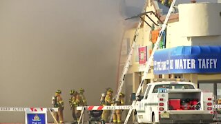 Amusement park fire sends smoke billowing, damages building