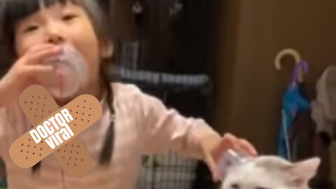 Cat Sits Patiently Whilst Little Girl Annoys Her With String Phone - DoctorViral
