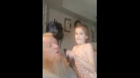 Bella Combing Grandpa's Beard. She's been doing this since she was little!